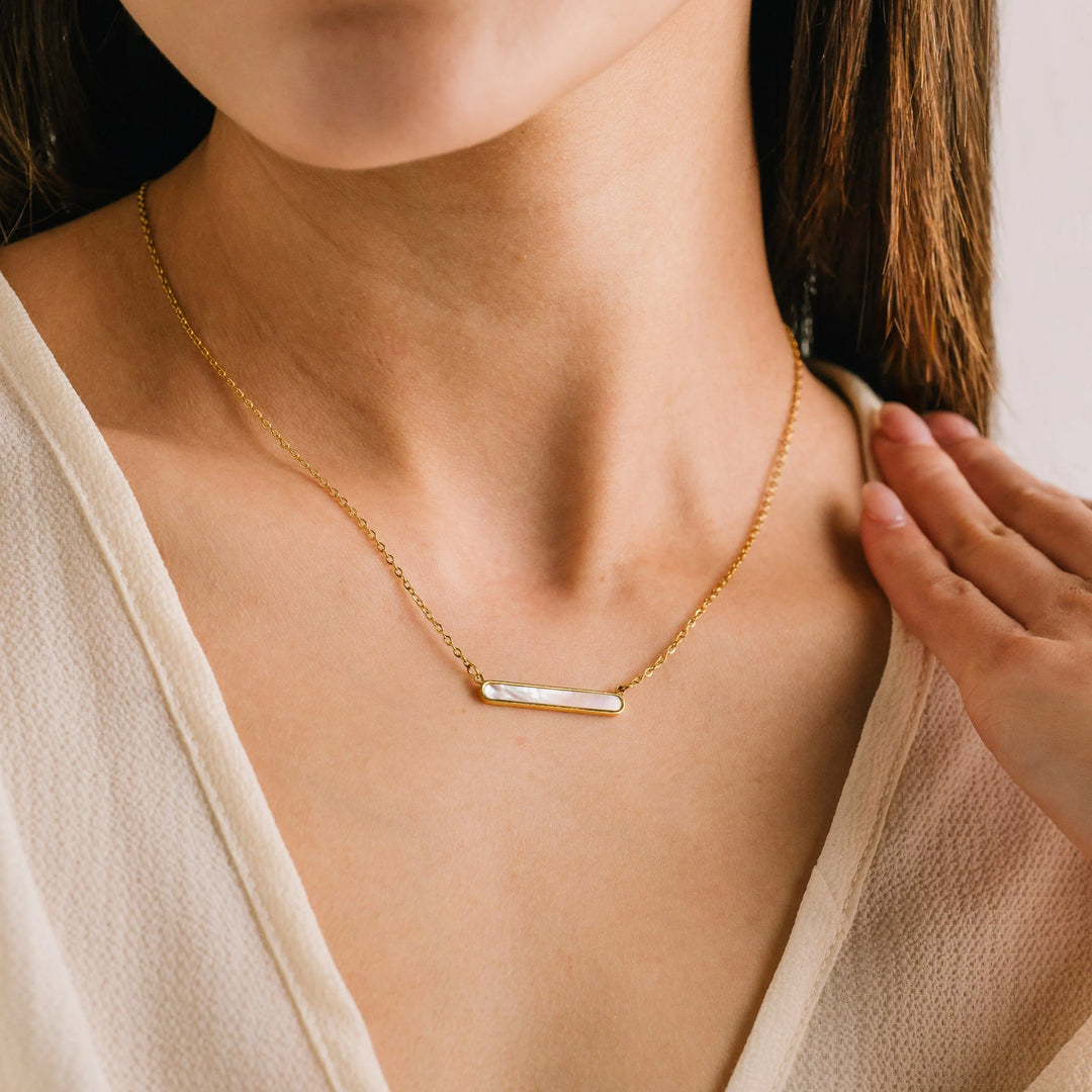 Lover's Tempo Tolfino Mother of Pearl Necklace featuring a delicate goldchain and shimmering mother of pearl pendant.