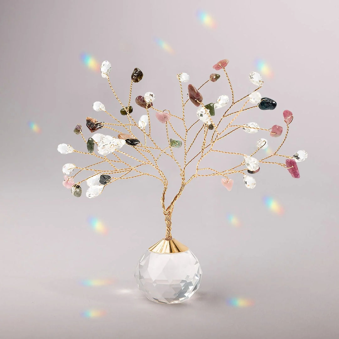 Colorful gemstone Tree of Life suncatcher hanging with intricate branches and vibrant stones, representing Scout Curated Wears.