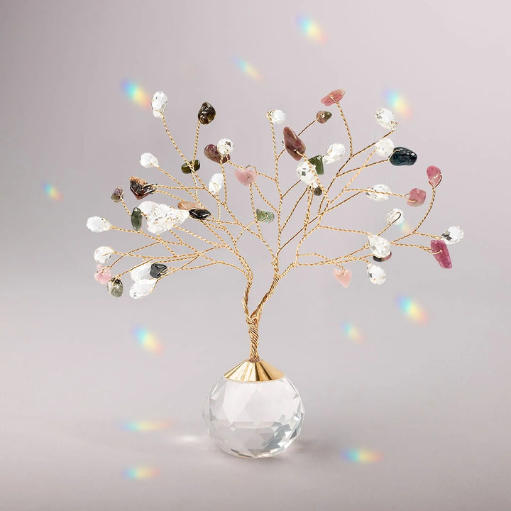 Colorful gemstone Tree of Life suncatcher hanging with intricate branches and vibrant stones, representing Scout Curated Wears.