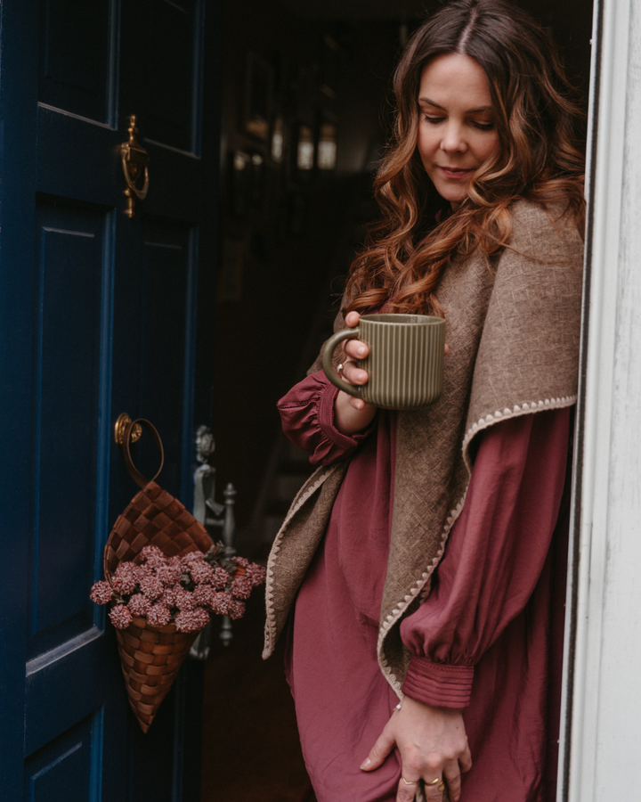 Marise knit triangle scarf from The Korner featuring soft, warm fabric in a stylish knit design, perfect for layering and added warmth.