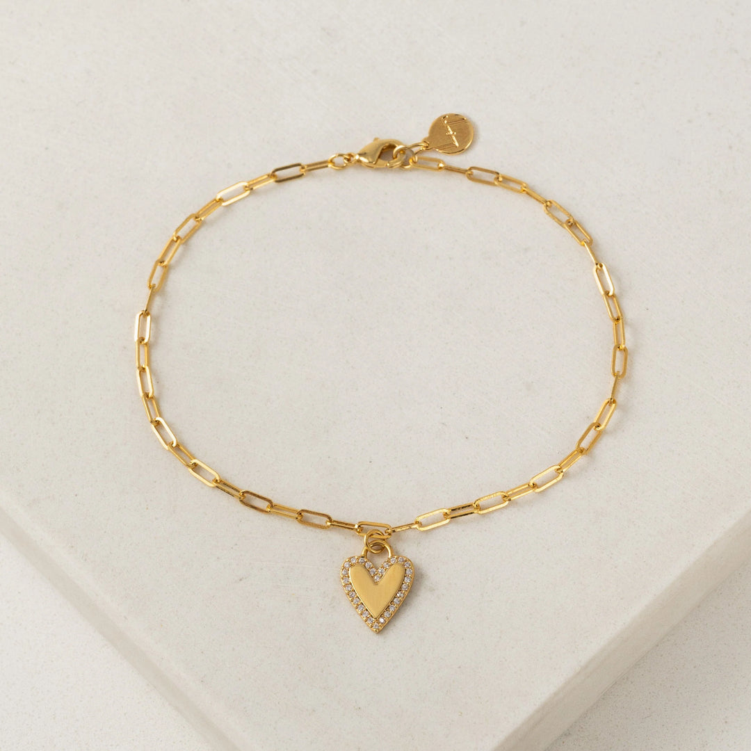 Women’s gold plated paper clip chain bracelet with cubic zirconia stones on heart charm