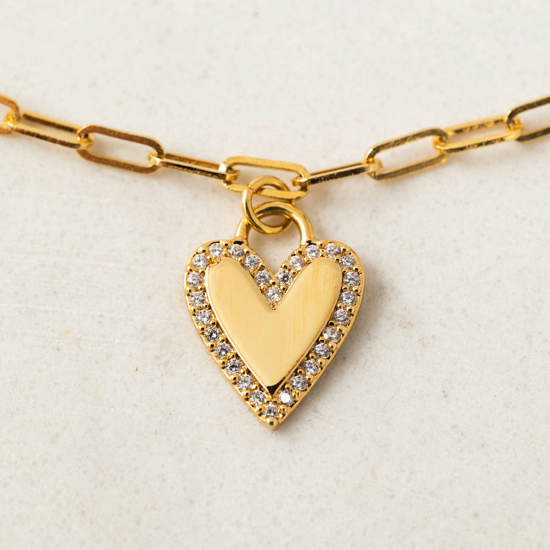 Women’s gold plated paper clip chain bracelet with cubic zirconia stones on heart charm