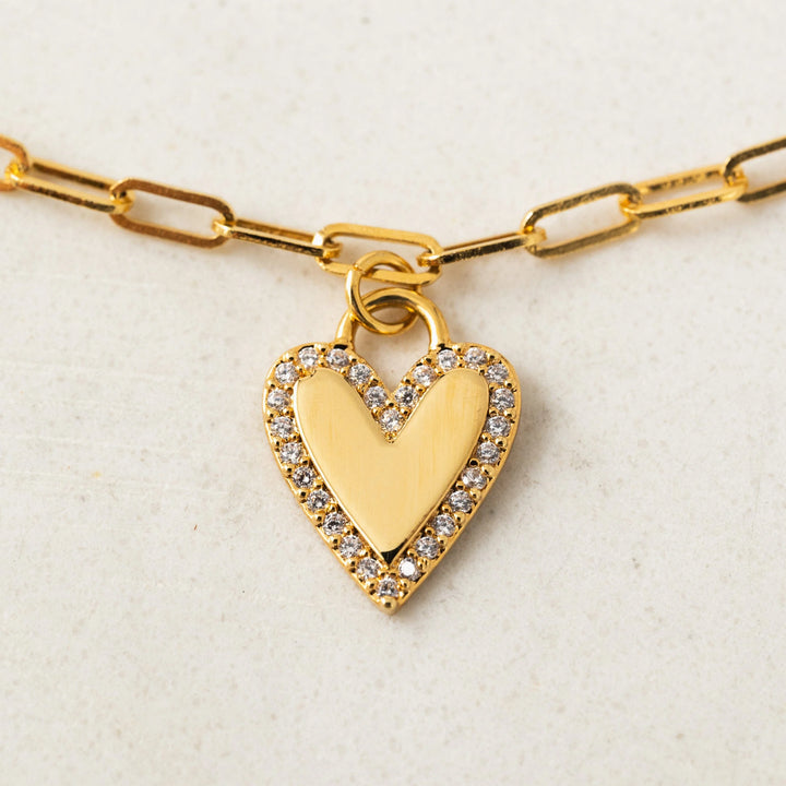 Women’s gold plated paper clip chain bracelet with cubic zirconia stones on heart charm