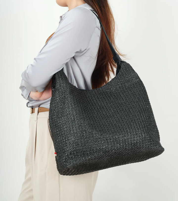 Black Vivi Raffia Hobo Shoulder Bag by CoLab featuring woven raffia texture and a relaxed, stylish tote design.