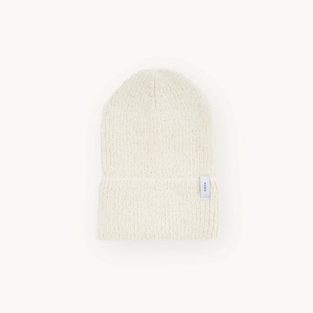 White alpaca wool knit beanie on a white background