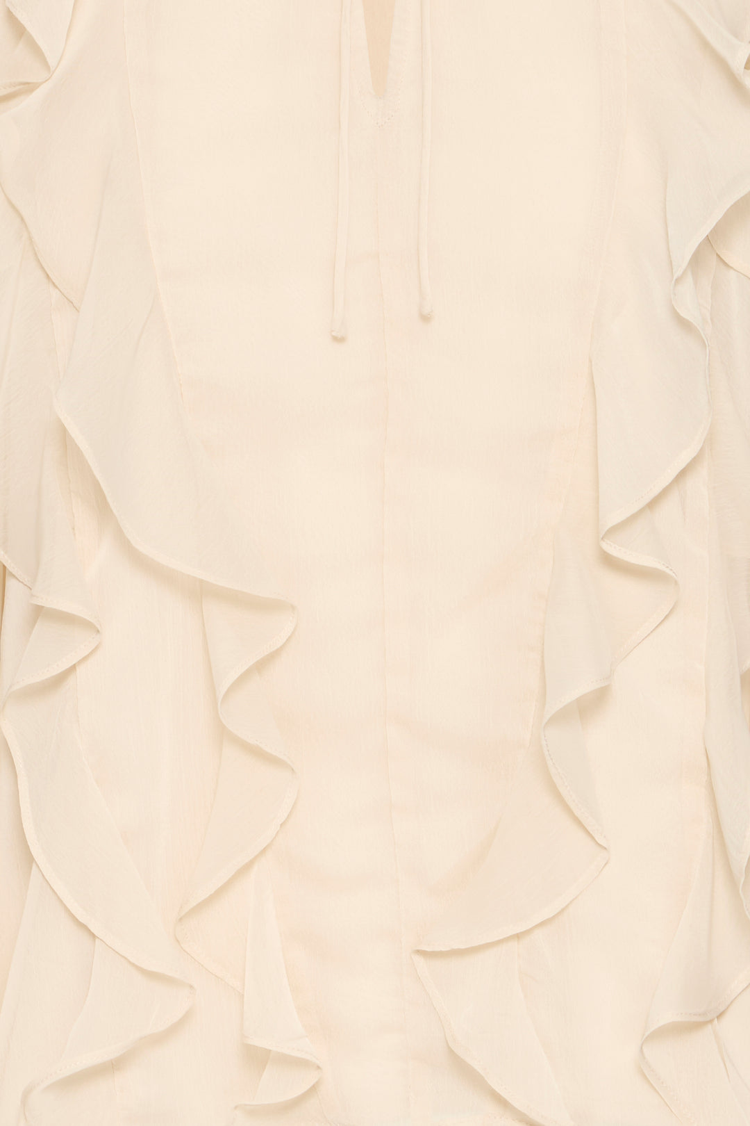 Close-up of a cream-colored fabric with ruffled texture