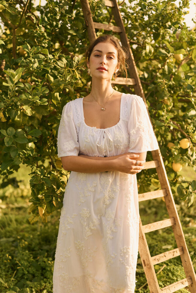 Cream Zammi Maxi Dress showing flowing fabric, textured floral embroidery, and elegant design, perfect for summer or special occasions.