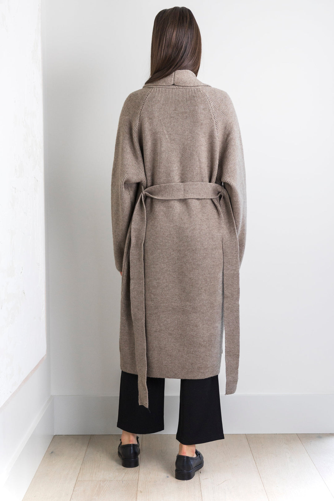 Long taupe knit cardigan with tie waist and front pockets.