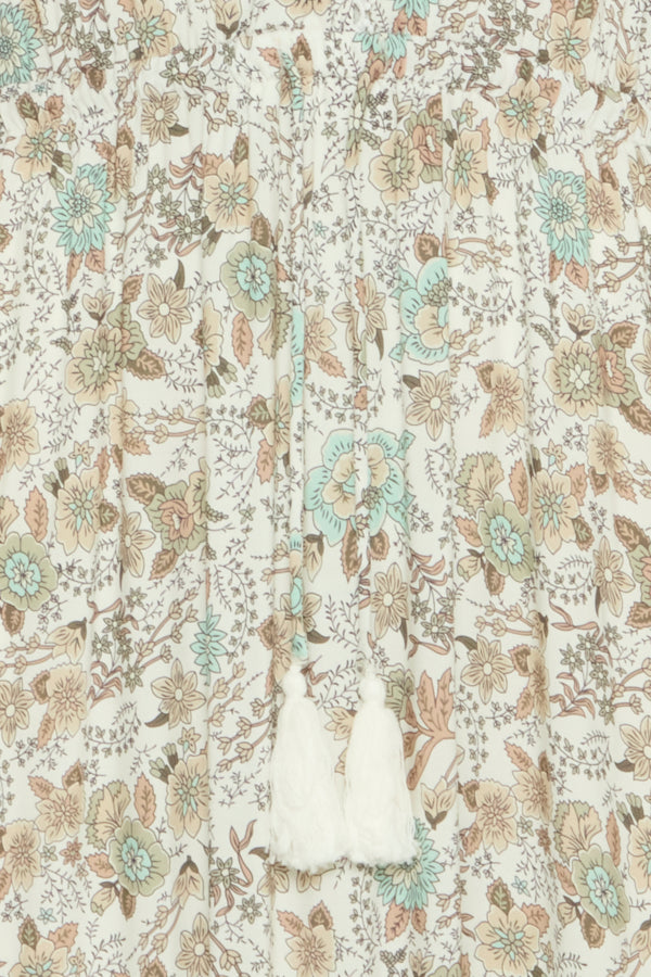 light green, beige and cream boho floral  maxi dress with tassel tie at waist and embroidered trim at v neckline. 