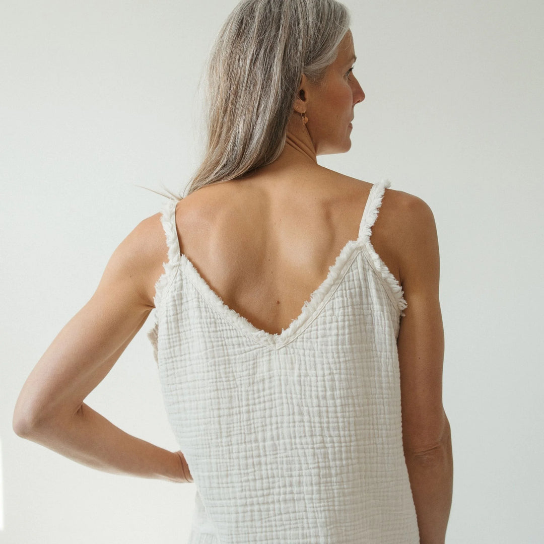 Pokoloko crinkle cotton strappy tank top with thin frayed straps and a relaxed, breathable fit for casual wear.