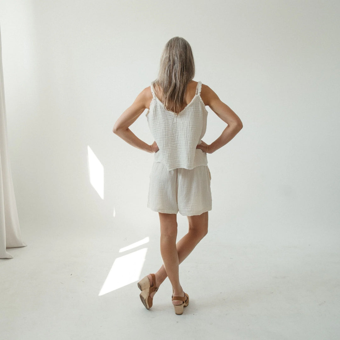 Crinkle cotton strappy tank top by Pokoloko, featuring lightweight fabric and adjustable frayed straps, ideal for casual wear.