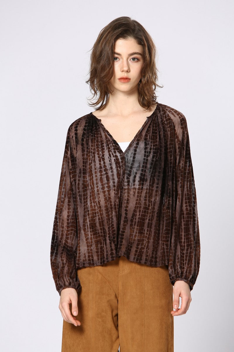 dark brown blouse with semi-sheer, animal print–inspired texture, V-neckline, and draped crossover front