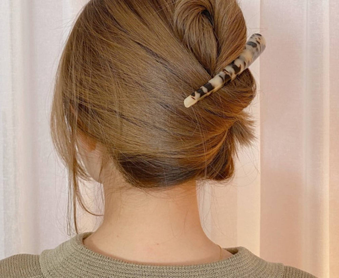 LadyJuneAccessories banana-shaped hair clip securing hair in a stylish, playful accessory for everyday wear.