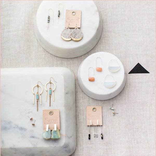 gold dipped hypoallergenic teardrop earring with natural stone coral fossil