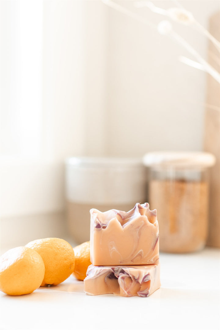 RavenSong Soap & Candle Sunrise Harvest artisan hand soap with citrus and patchouli scent, featuring a rustic soap bar with natural ingredients.