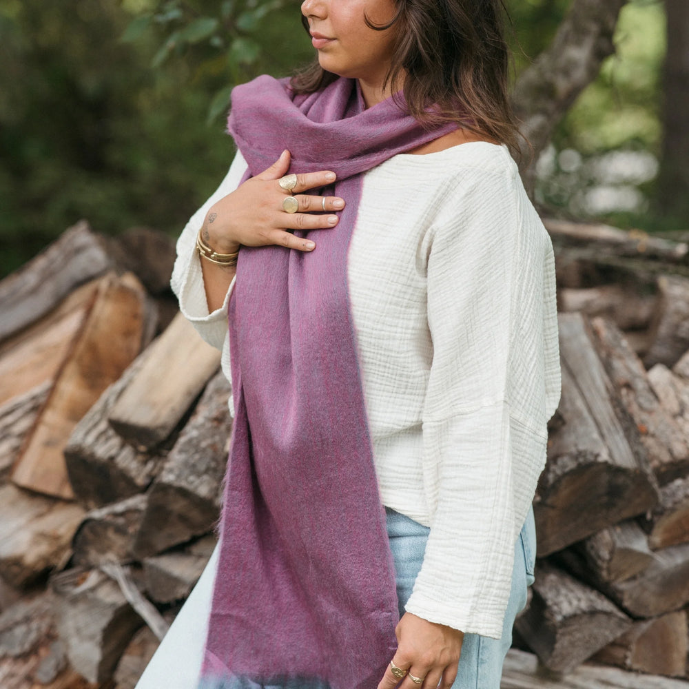 Pokoloko alpaca wool seamless scarf in soft, cozy fabric with a neutral color, draped to showcase its lightweight and warm design.