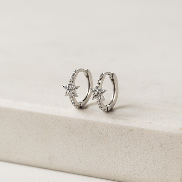 silver star huggie hoop earrings