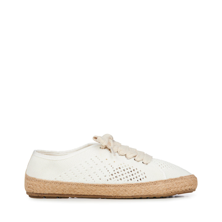 White sneaker with jute sole on a white background