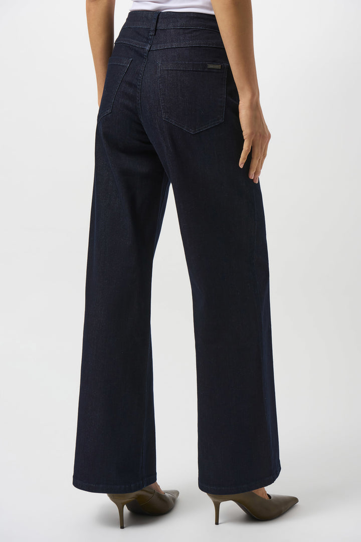 woman wearing dark rinse jeans